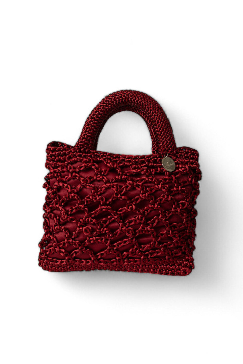 Cartera tejida color guinda.