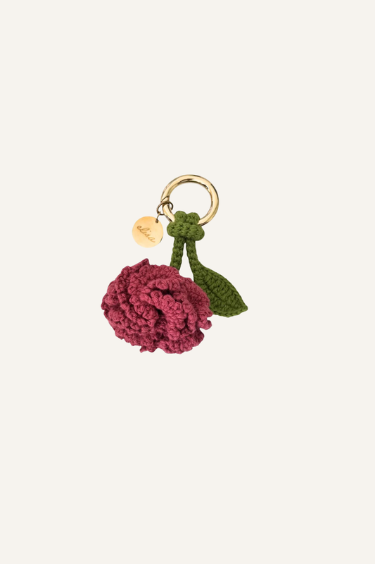 Charm flor tejida